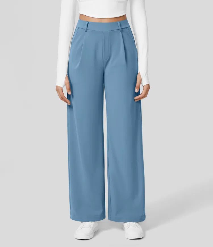 Blue wide-leg pants worn by a person on a light gray background