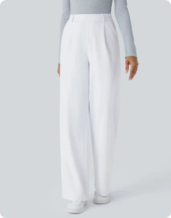 Person wearing white pants and a light gray top on a white background
