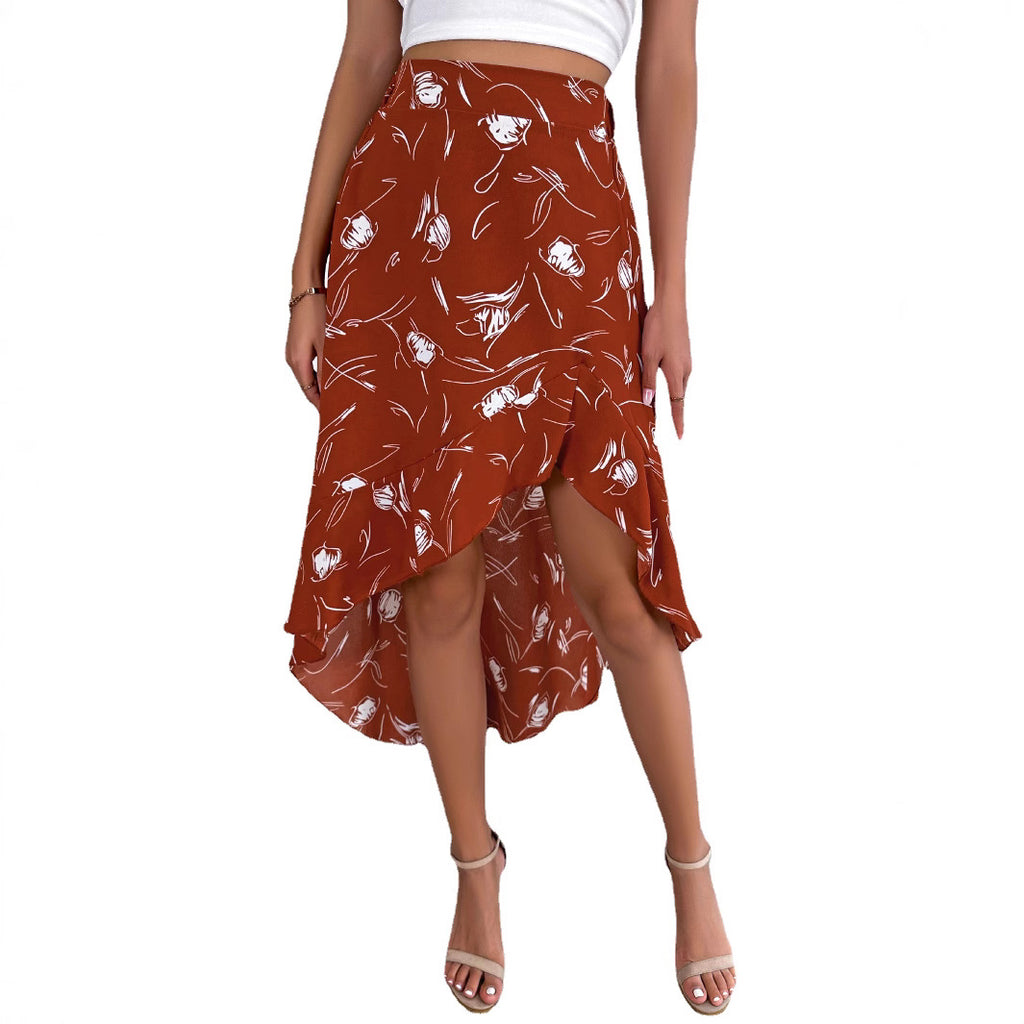 Woman wearing a rust-colored skirt with white floral pattern on a white background