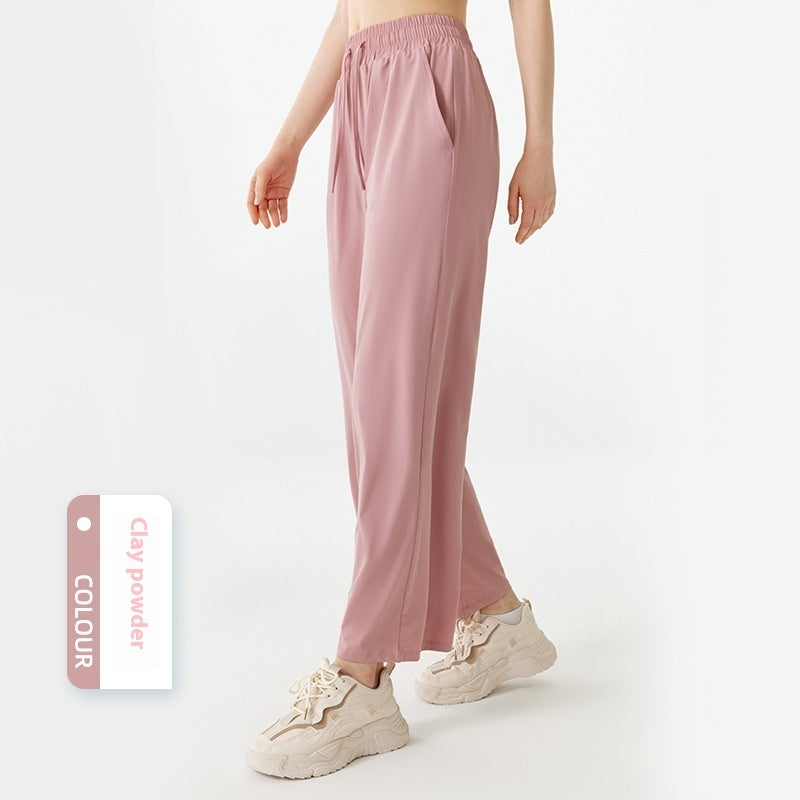 Person wearing pink pants with a color swatch labeled 'Clay Powder' on a white background