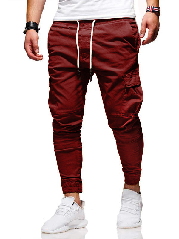 Maroon jogger pants with white drawstring on a white background