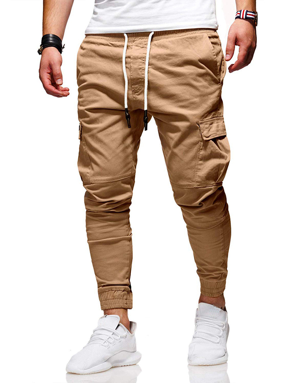 Beige cargo jogger pants worn by a person on a white background