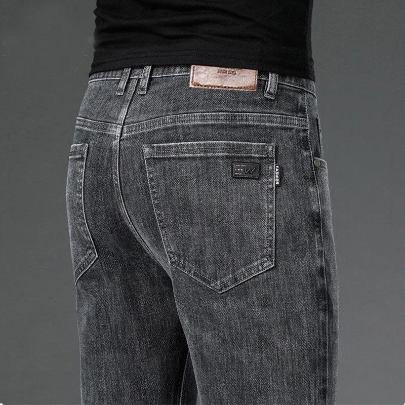 Gray jeans with a brand label on a gray background