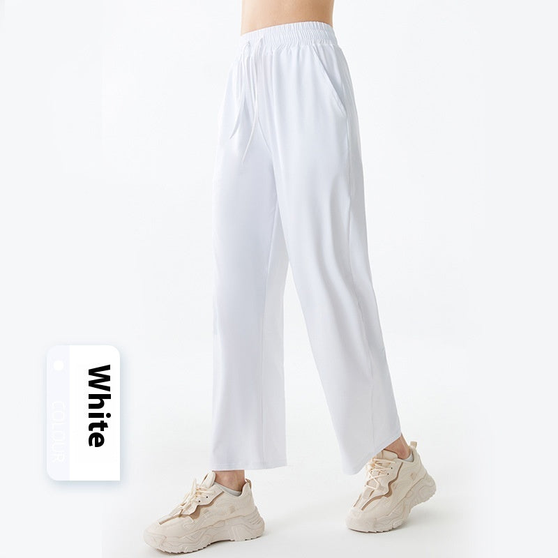 White pants worn by a person on a white background with 'White' label.
