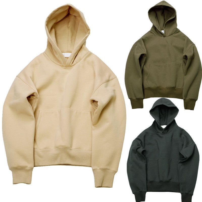 Three hoodies in beige, green, and gray on a white background
