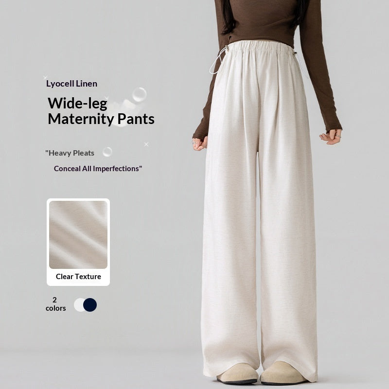 White wide-leg maternity pants worn by a model on a gray background with product details.