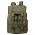 Green backpack with brown leather straps